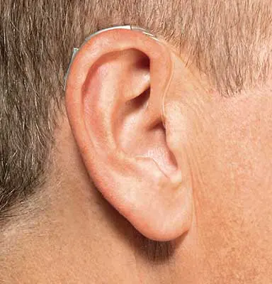 A man with an ear ring on his right side.